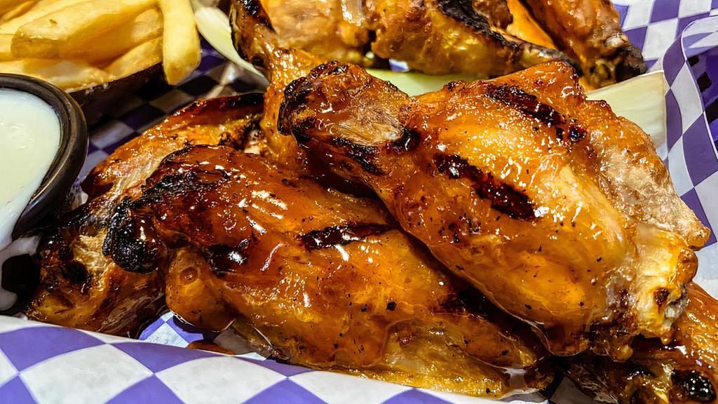 Traditional Wings  · Traditional bone in wings fried and tossed in sauce. Served with ranch or blue cheese and charred upon request.