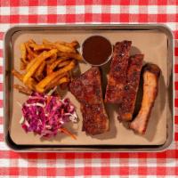 Bbq Smoked Pork Ribs · House smoked pork ribs served with your choice of 2 signature sides.