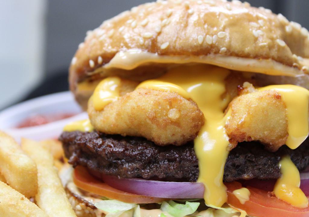 Cheese Curd Burger · Patty Burger,  Cheese Curds, Nacho Cheese Sauce, Lettuce, Tomato, Onions, Chipotle Mayo, Sesame Bun, Fries