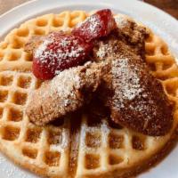 Chicken & Waffles · Seasoned Chicken Wings atop a fluffy Belgian Waffle sprinkled with strawberries and powdered...