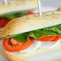 Caprese Sandwich · V | Fresh mozzarella, fresh basil, sliced tomato and olive oil.