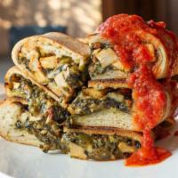 Chicken Stromboli · Rolled pizza dough stuffed with herb-roasted chicken, spinach, mushroom, crushed tomatoes, g...