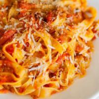 Fettuccine Bolognese · Our housemade fettuccine with classic tomato meat sauce made with pork and beef.