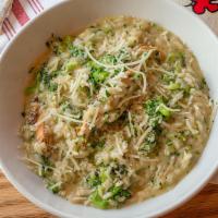 Chicken Mushroom Risotto · GF | Risotto with grilled chicken, mushrooms, broccoli, Alfredo butter, topped with Grana Pa...