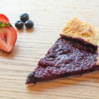 Triple Berry Crostata · Flaky pie crust with a raspberry, strawberry and blueberry filling.