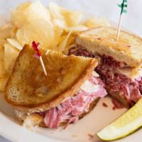 Big Reuben Sandwich · Thinly sliced corned beef, swiss cheese, kraut or slaw and thousand island dressing on grill...