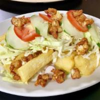 Yuca Frita · Friend yucca topped with your choice of chicken or chicharron.