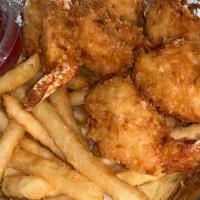 Camarones Con Coco · Fried coconut shrimp served with cajun french fries.