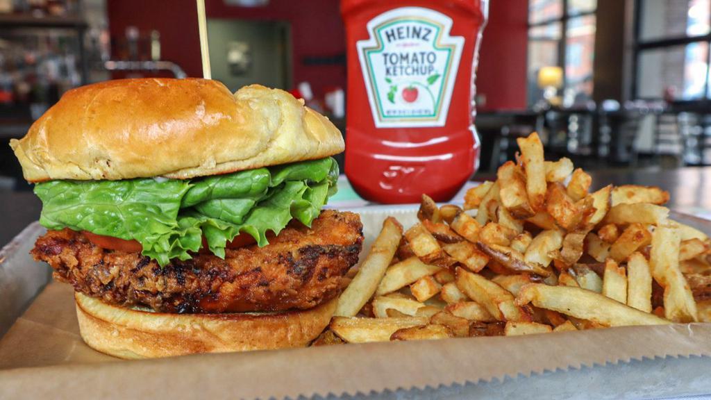 Classic Fried Chicken Sandwich · Hand breaded chicken breast fried and topped with American cheese. Dressed in mayonnaise, lettuce, tomato, bread, and butter pickles. Served with fries. 
Get it tossed in your favorite sauce