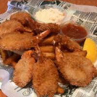Jumbo Shrimp · Eight pieces of breaded shrimp. Served with coleslaw and a pile of fries.