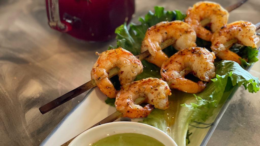 Fire Grilled Shrimp Skewers · Jumbo shrimps marinated and grilled to perfections. 2 skewers per order, served with special lime sauce.