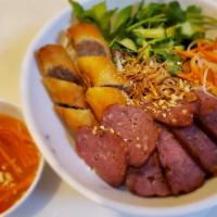 Bun Nem Nuong (Grilled Pork Roll · Grilled pork roll with eggroll. Served with fresh vegetables, noodles, and fish sauce. It's ...
