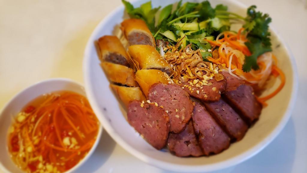 Bun Nem Nuong (Grilled Pork Roll · Grilled pork roll with eggroll. Served with fresh vegetables, noodles, and fish sauce. It's a Vietnamese style salad.