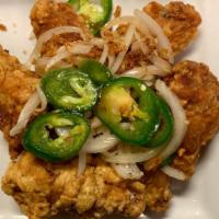 Salt & Pepper Chicken Wing (6 Pc) · Spicy. Hot & Spicy. 
Deep-fried chicken wing sauteed with fresh onion and jalapeño