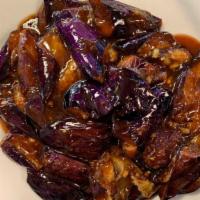 Stir-Fried Eggplant · Spicy. Hot & Spicy. 
Stir-fried in our homemade spicy sauce