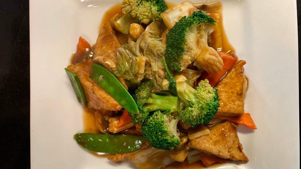 Home Style Tofu · Deep fried tofu stir-fried with broccoli, baby corn, napa, snow pea, and carrot in a brown sauce