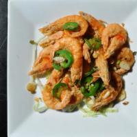 Salt & Pepper Shrimp (椒盐虾） · Hot & Spicy. 
Dipped in batter and fried shrimps with head sautéed with fresh jalapeño