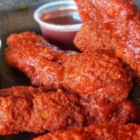 Buffalo Chicken Tenders · 5 Made from Scratch Buttermilk Marinated Chicken Tenders/Strips, Hand Breaded!  Tossed in a ...