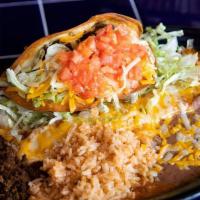 Fernando'S Favorite · One enchilada, (beef, chicken, or seafood) and one taco (beef or chicken) with a side of bea...