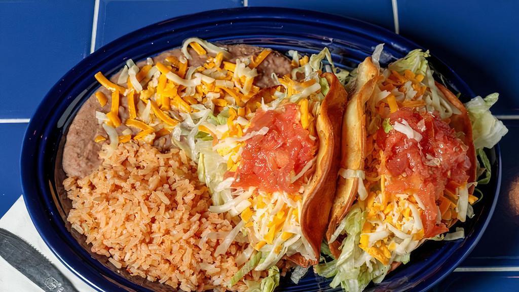 Taco Plate · Two tacos (beef or chicken) with a side of beans and rice.