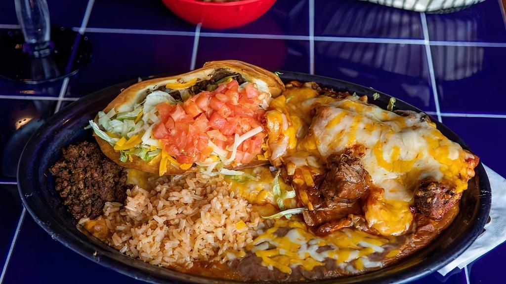 Tamale Combo · One tamale, one enchilada (beef, chicken, or seafood) and one taco (beef or chicken) with a side of beans and rice. No substitutions please.