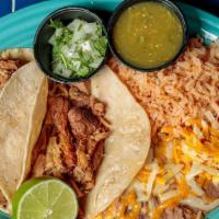 Carnitas Tacos · Shredded seasoned copper pot cooked pork shoulder in two soft corn tortillas served with ric...