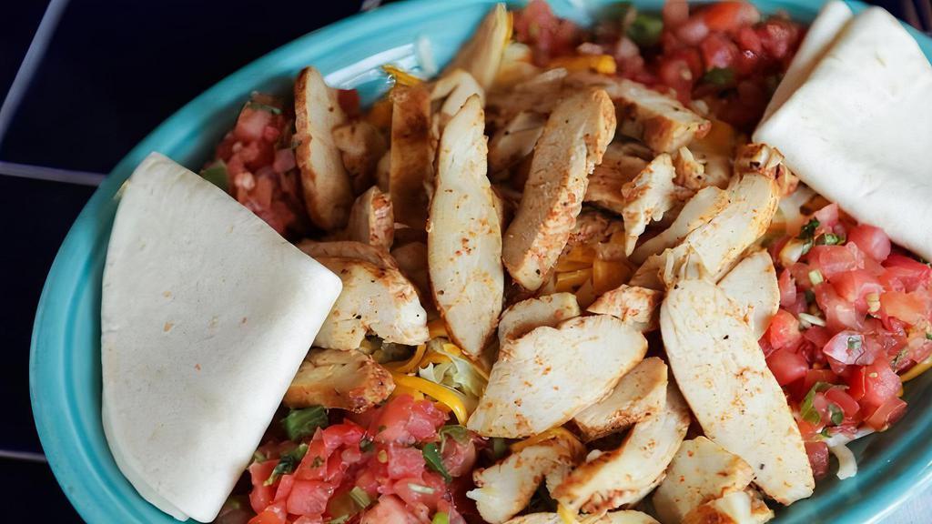 Fajita Salad · Fajita seasoned chicken breast or steak on a bed of lettuce with cheese and salsa. Served with flour tortillas.