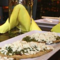 Tlacoyos · Three fresh handmade oval toasted corn cakes stuffed with black refried beans, doused in tom...