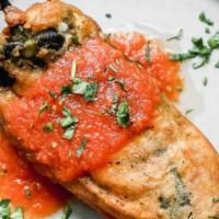 Chile Relleno De Queso · Roasted poblano pepper stuffed with cheese,  topped with red mild salsa, queso fresco and so...