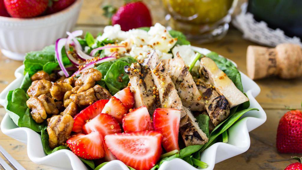 Strawberry Pecan Grilled Chicken Salad · Field greens, crisp romaine, fresh strawberries, red onion, smoked bacon, candied pecans, grilled chicken, bleu cheese, pear-gorgonzola vinaigrette