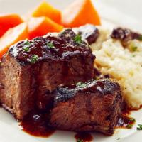 Beef Short Ribs · Tender braised beef short ribs, port wine Demi-glace, roasted mushroom risotto, glazed carro...