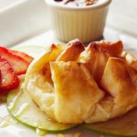Baked French Brie · Brie and orange marmalade in a crisp, honey-drizzled phyllo shell. Apricot, orange, and crac...