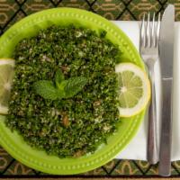 Tabouleh Salad · Cracked wheat mixed with chopped tomato, parsley, onion, lemon juice, and olive oil