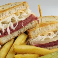 Irish Beef Sandwich & Fries · Thinly sliced lean Vienna corned beef on a soft pretzel bread topped with a sweet pickle spe...