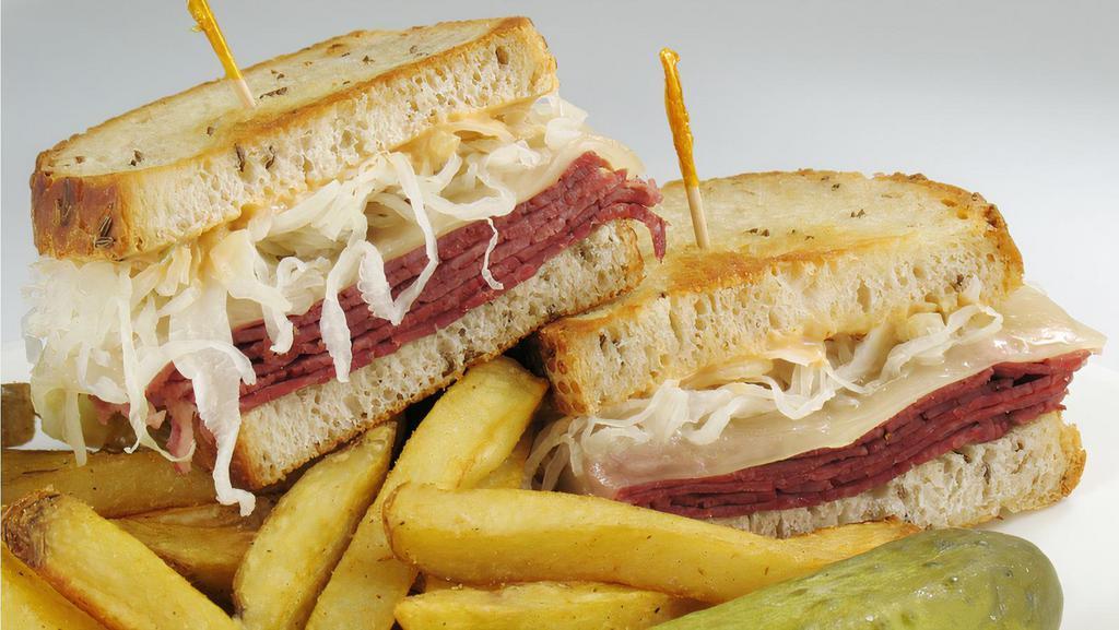 Irish Beef Sandwich & Fries · Thinly sliced lean Vienna corned beef on a soft pretzel bread topped with a sweet pickle spear and your choice of mustard, thousand island or horseradish.