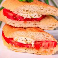 Caprese Sandwich · Sliced tomato, basil, fresh mozzarella cheese, and balsamic dressing.
