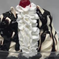 Hot Fudge Brownie Boat Special · Two towers of vanilla soft serve with hot fudge whipped cream and a cherry!