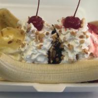 Banana Split Special · Available in vegan.  
Two towers of vanilla soft serve with strawberries, pineapple, chocola...