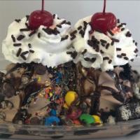 Death By Chocolate Special · Two towers of chocolate soft serve.
Topped with chocolate syrup, nestle crunch, oreos, m&ms ...