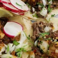 American Burrito · Your choice beans, rice, onion lettuce, tomatoes cilantro cream flour tortilla.