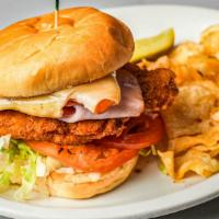 Chicken Cordon Blue · Breaded chicken breast topped with gobs of ham and Swiss with lettuce, tomato, and mayo on a...