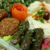 Appetizer Combo · Hummus, falafel, fattoush salad and grape leaves.