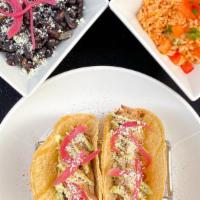 Pork Carnitas Tacos · Two corn tacos filled with overnight slow cooked pork carnitas, topped with our pickled red ...