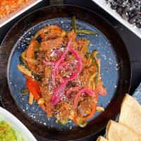 Chipotle Beef Barbacoa Fajitas · Traditional Tex-Mex Fajitas with chipotle beef barbacoa, sautéed poblano, red & green pepper...