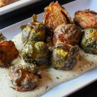 Sprouts · Brussel sprouts flash fried and dusted in Augie seasoning. Served over house made garlic aio...