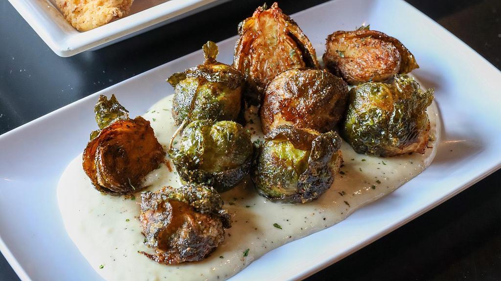 Sprouts · Brussel sprouts flash fried and dusted in Augie seasoning. Served over house made garlic aioli.