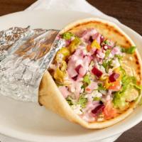 Chicken Greek Pita · Marinated chicken breast, with lettuce, tomatoes, onion, pepperoncini & beets topped off wit...