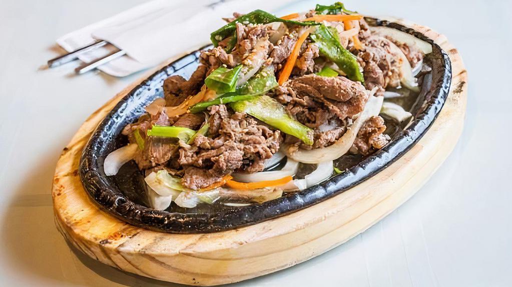 Beef Bulgogi · Thin sliced beef marinated in home-made sauce with onions, carrots, and green onions.