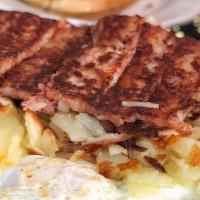 2 Center Cut Pork Chops · served with 2 eggs hash browns and toast