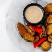 Fried Dill Pickles · Dill pickle chips with seasoned cornmeal and deep fried. Served with barbecue ranch.